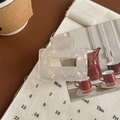 Close-up of square holographic pearl white hair claw clip on vintage aesthetic background - Iridescent White