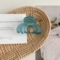 Detail of blue acetate hair claw clip showing France Handmade gold lettering - Aqua