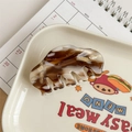 Detail of tortoise shell acetate hair claw clip with golden YD metal logo decoration - Brown