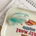 Macro detail of large acetate hair claw with mint green marble pattern and gold YD logo - Sky Blue