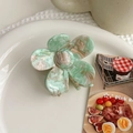 Detail of mint green marble acetate flower hair claw clip with golden handmade stamp - Light Green