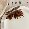 Detail of tortoise shell butterfly hair claw with amber and blue acetate texture - Lake Blue Coffee