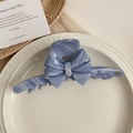 Pinza per capelli in acetato marmorizzato blu con fiocco e dettaglio dorato - Striscia Blu
