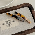 Detail showing tortoise shell acetate hair clip set with gold lettering on wood tray - Deep Leopard (With Card)