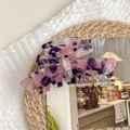 Detailed top view of large marble purple acetate hair claw clip on woven texture background - Rose Purple