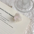 Detail of elegant pearl white acetate hair claw clip with golden French lettering - Pearl White