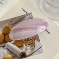 Close-up of marble pattern purple acetate barrette with gold Barrette La France lettering - Striped Pink