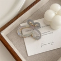 Detail view of small gradient butterfly hair claw with golden metal spring mechanism - Gray Blue