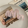 Macro shot of large wavy pink hair claw clip with iridescent finish on a stylish table - Iridescent Pink-11cm