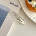 Detailed view of pearlescent white cloud hair clip with iridescent finish on soft leather - Pearl White