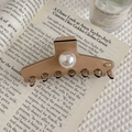 Close-up of elegant cream hair claw clip with large pearl on luxury magazine background - Outlined Metal Logo (Pink) / Pink