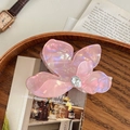 Close-up of elegant pink pearlescent flower hair claw clip with crystal drop accent - Large - Iridescent Purple