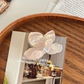 Détail de la pince à cheveux fleur rose irisée avec cristal en forme de goutte - Petit - Jaune Irisé