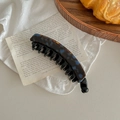 Close-up of tortoise shell banana hair clip with double teeth on a vintage linen background - Lake Blue Brown