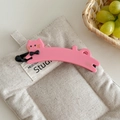 Detailed view of pink cat-shaped banana hair clip with France Handmade engraving - Pink