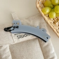 Detail of grey-blue cat banana hair clip with bow and France Handmade inscription - Blue