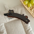 Close-up of black cat banana hair clip with golden France Handmade engraving details - Brown