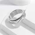 Close-up of 8mm silver spinner ring featuring punk mesh texture and rotating gears - US 7 / Silver Twill Spinner