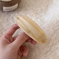 Close-up of beige marble acetate hair clip with Barrette La France gold lettering - Milk Coffee