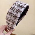Close-up of a wide pink and brown tweed headband with metallic gold fiber texture - Coffee Pink
