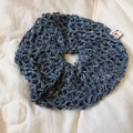 Close-up of blue and white hollow crochet oversized hair scrunchie with woven label detail - Navy Blue