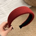 Detail of dark red padded sponge headband with soft matte velvet texture and non-slip lining - Red