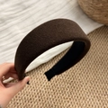 Detailed close-up of dark brown velvet sponge headband with non-slip inner lining - Brown