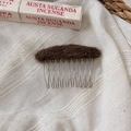 Detail of plush dark brown wool felt oval top and polished silver metal hair comb tines - Brown
