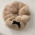 Detail of plush khaki scrunchie featuring fuzzy texture and a brown velvet bow accessory - Hair Tie / Khaki