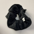 Detail of wool-like grey hair scrunchie showing fabric texture and Hand Made label - Black Gray Scrunchie