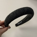 Detail of a handmade black wool scrunchie featuring a premium textured fabric finish - Black Grey Headband