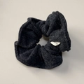 Detailed close-up of dark grey wool fabric scrunchie with handmade woven label - Navy Blue Scrunchie