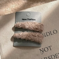 Close-up of elegant plush teardrop hair clips in khaki faux fur on a display card - Pink
