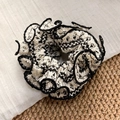 Chic cream and black scrunchie with geometric embroidery and ruffled edges decoration - White