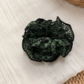 Detail of woven lace scrunchie with dark green floral embroidery and ruffled black edges - Green