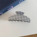 Detail view of large acetate hair claw clip featuring grey and blue gingham checkered patterns - Blue Gray White Checkered