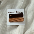 Macro detail of vintage acetate hair clips with marble texture on a white linen surface - Square Style Pair