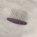 Close-up of purple herringbone fabric hair comb with ten silver metal teeth on linen - Plaid Purple Hair Comb