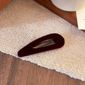 Close-up of a vintage wine red velvet BB hair clip on textured fabric background - Waterdrop Style / Waterdrop Wine Red