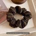Detail of vintage striped knit scrunchie with 9cm diameter size and elastic texture - Small Coffee
