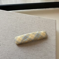 Handmade yellow and blue plaid fabric hair clip in preppy style on beige textured background - Plaid Rectangular