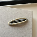 Detailed view of yellow plaid fabric hair clip with elegant woven texture and sturdy metal grip - Plaid Hollow Oval