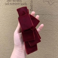 Detail view of the soft velvet burgundy layered bow hair clip with high quality texture - Large Wine Red