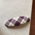 Close-up of a Korean style purple argyle checkered fabric oval hair clip on burlap - Plaid / Oval Style / Purple and White