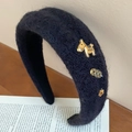 Diadema gruesa de punto azul marino con dijes dorados de caballo y flores - Negro