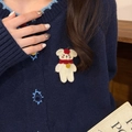 Cute white knitted bear brooch with red scarf on navy cardigan for winter coat accessory - Red Scarf Bear Brooch