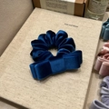 Detailed close-up of premium velvet bow scrunchies in navy blue and pastel colors - Royal Blue