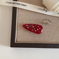 Detail of red acrylic hair clip with colorful crystals and silver ear cuff - Water Drop Shape