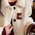 Detail of red plush bear brooch with traditional vest on cream fleece jacket - Wine Red Bear Style