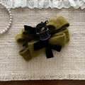Pinza per capelli in maglia verde con fiocco per capelli folti su sfondo elegante - Verde